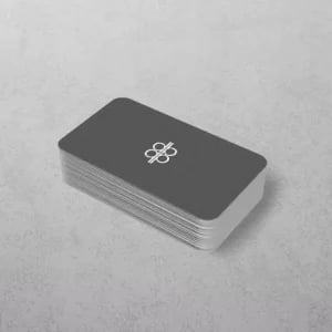 Stack of grey plastic business cards with rounded corners