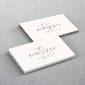 Two white business cards with a spot UV logo
